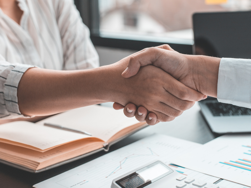 Two people shaking hands.